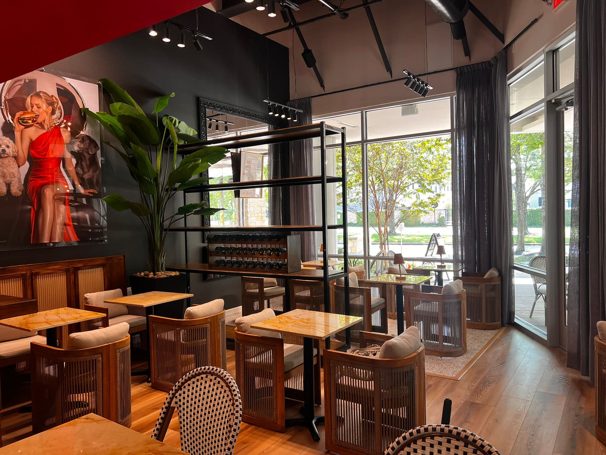 The dining room at TW GRILL, with the house artwork on the wall